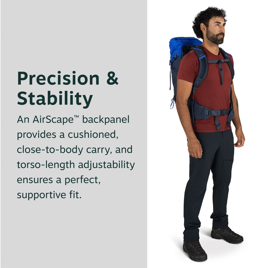 The image shows a person standing while wearing a backpack, featuring the AirScape? backpanel design. The backpack is blue, and it is secured with adjustable straps at the shoulders and waist for a supportive fit. The person is wearing a red t-shirt, blac