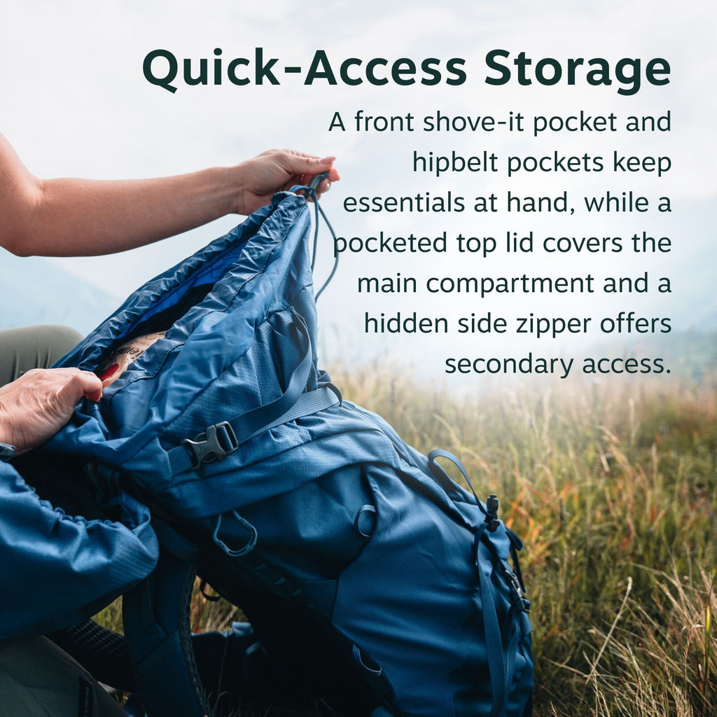The image shows a close-up of a blue backpack being held by a person's hand in an outdoor setting with grass and hills in the background. The backpack has several features highlighted by text on the image, including a front shove-it pocket, hipbelt pocket