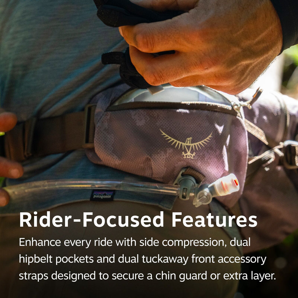 The image shows a person wearing a backpack designed for riders, highlighting its practical features. The backpack includes side compression, dual hipbelt pockets, and dual tuckaway front accessory straps. These features are designed to enhance the riding