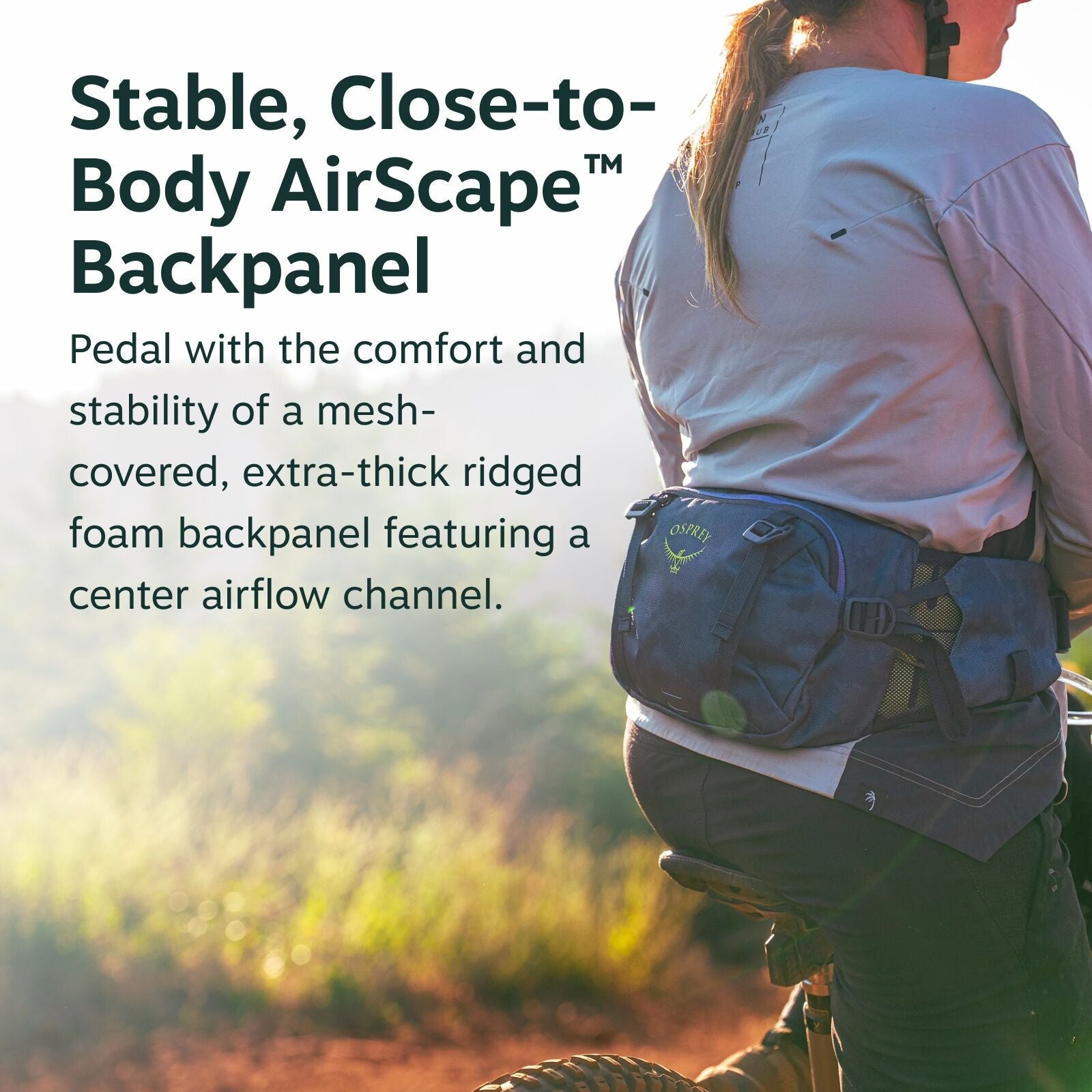 The image shows a person riding a bicycle, wearing a blue Osprey waist pack or backpack. The person is dressed in a long-sleeve shirt and is situated in a setting with lush vegetation and sunlight streaming in. The text in the image highlights features of