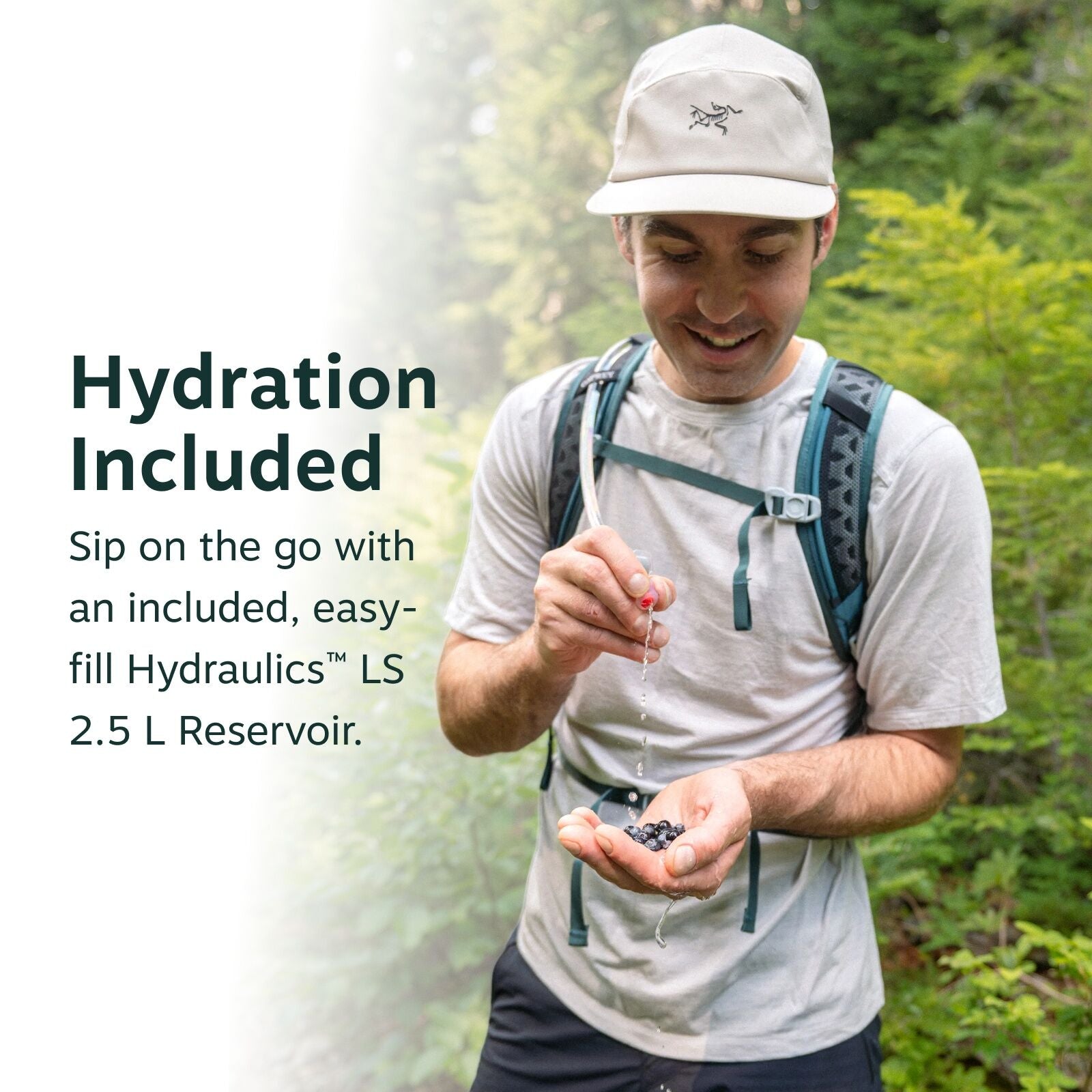 The image features an outdoor scene with a person standing in a lush green forest, wearing a light gray T-shirt and a gray backpack. They are holding a handful of dark berries in one hand, with water dripping from the other hand as if they are rinsing the