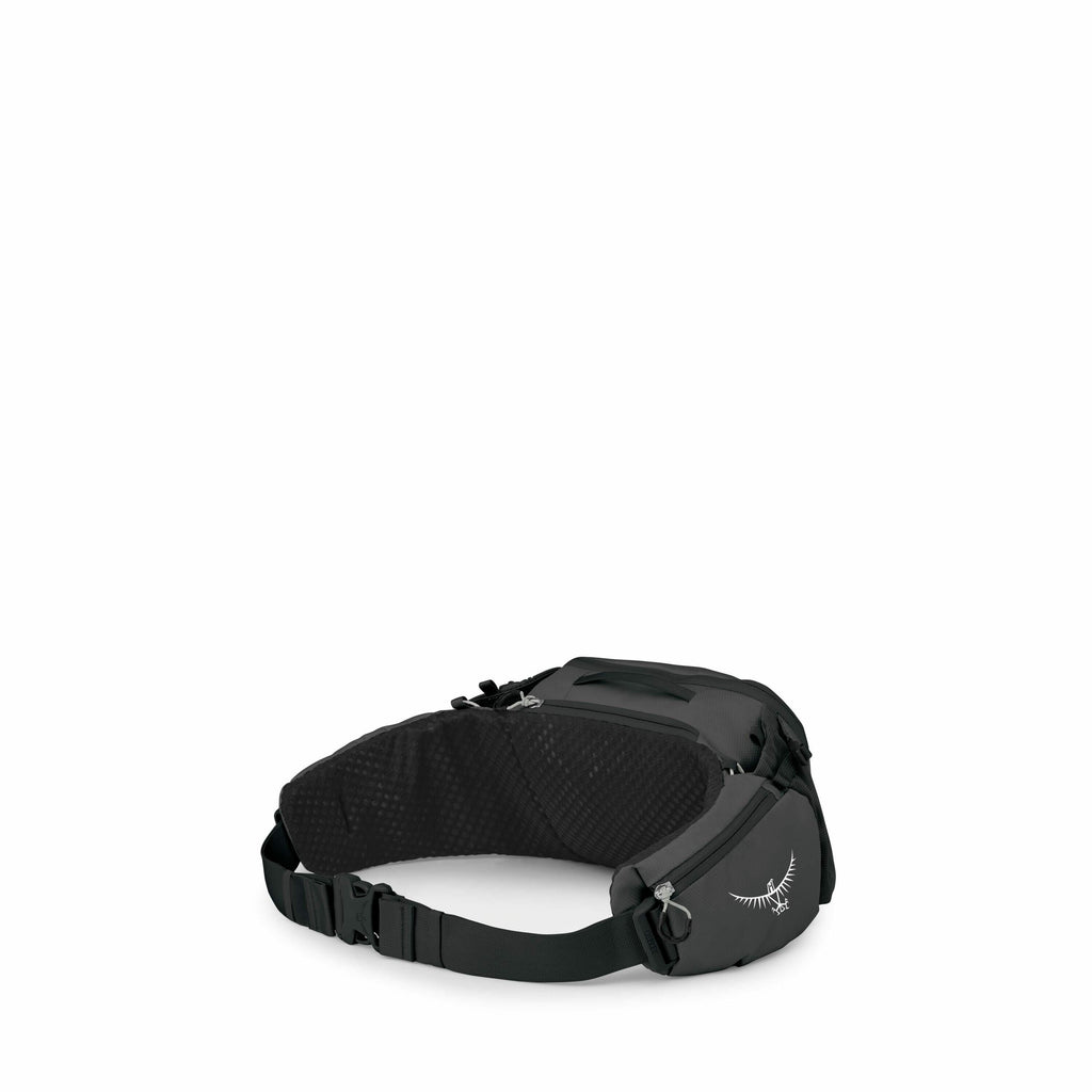 The image shows a black waist pack made by Osprey, featuring a sleek and compact design with multiple compartments. The pack is crafted with durable material and includes a wide, adjustable strap for securing it around the waist. The Osprey logo, a styliz