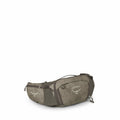 The image showcases a waist pack by Osprey, a brand known for its outdoor gear. The pack is primarily featured in a green camouflage pattern with the Osprey logo prominently displayed. It has multiple compartments, zippers, and adjustable straps for secur