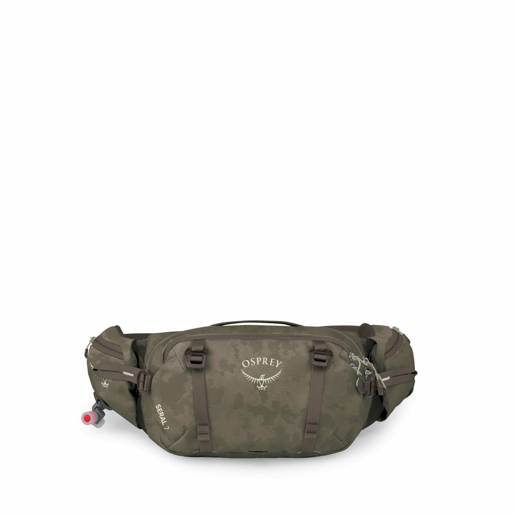 The image depicts an Osprey Seral 7 waist pack in various green tones. The pack features multiple compartments and straps, designed for efficient storage and ease of access during outdoor activities. Prominently displayed is the Osprey logo, an emblem wit