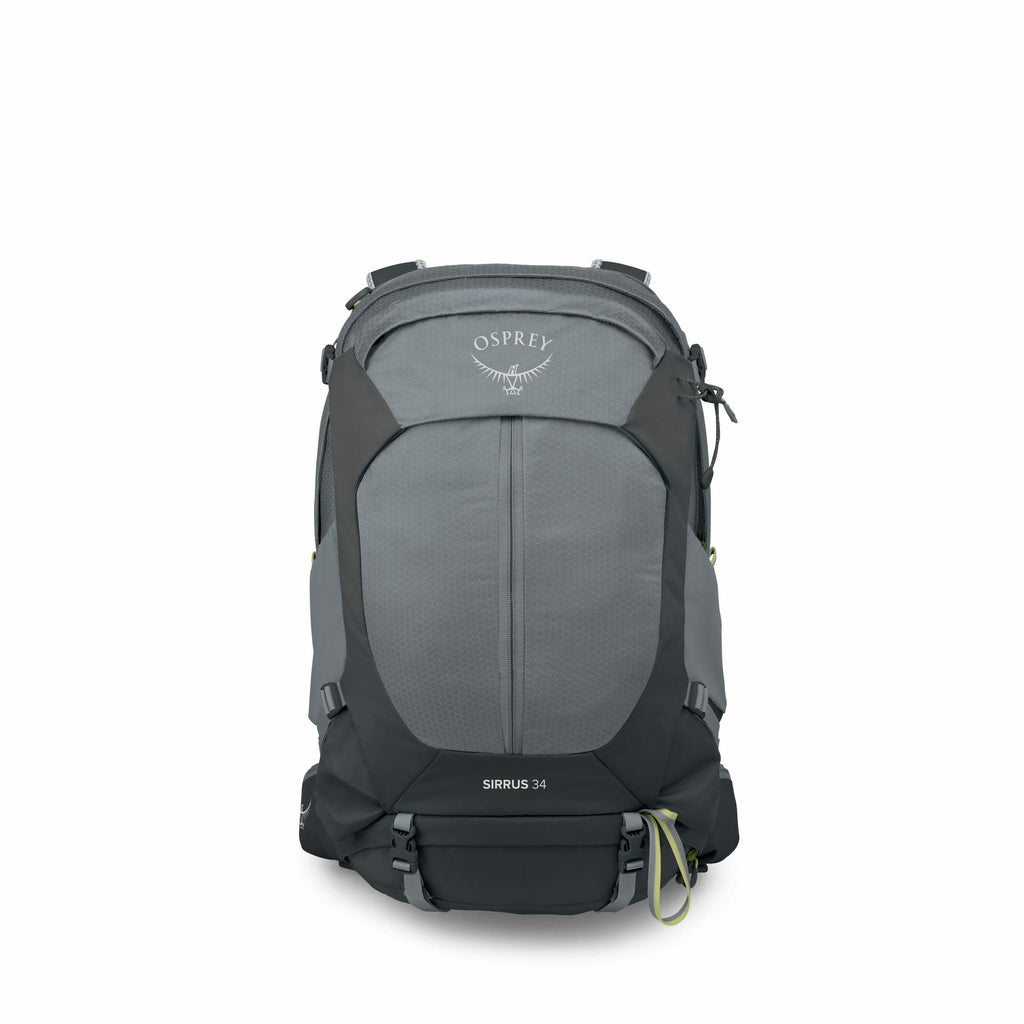 The image features a backpack designed for outdoor activities, specifically the Osprey Sirrus 34 model. The backpack has a two-tone color scheme with the main body being a muted grey and black accents on the sides and base. It has a streamlined design wit