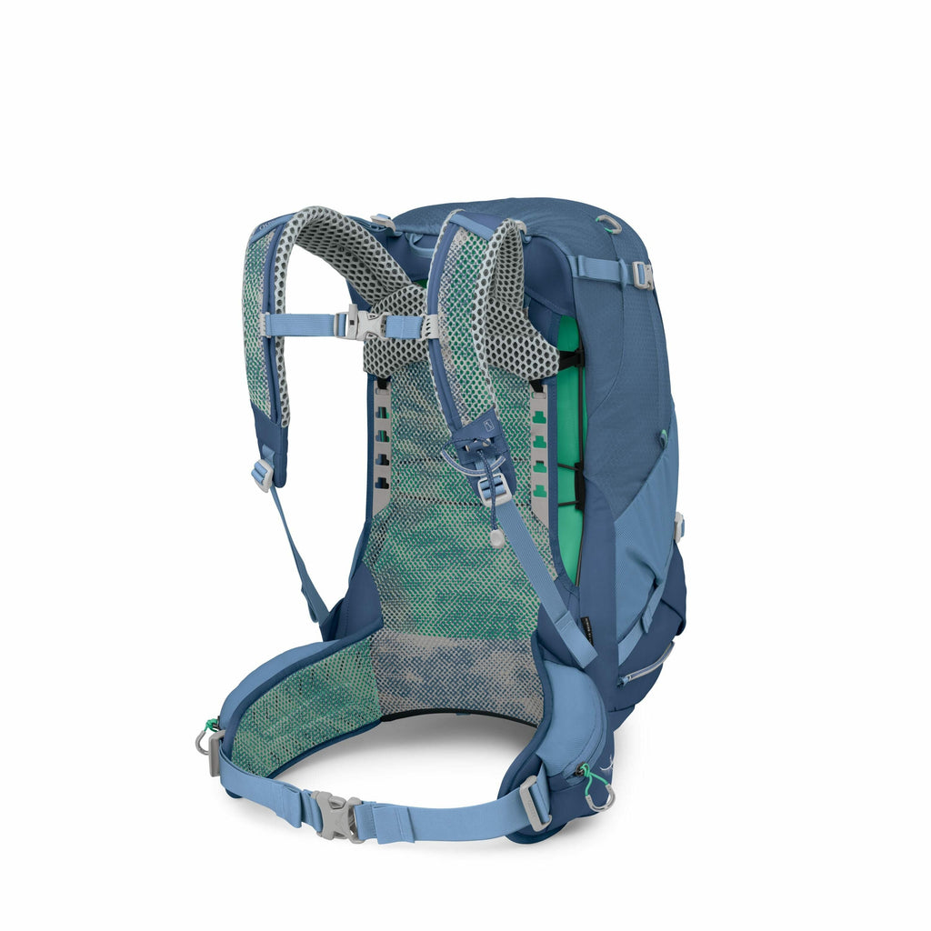 The image depicts a blue backpack designed for outdoor or hiking use, with a focus on its back panel and harness system. The backpack features padded shoulder straps with an adjustable chest strap and a waist belt for improved comfort and stability during
