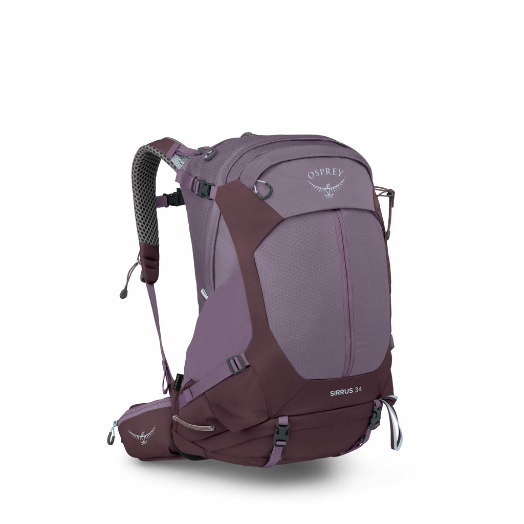 The image depicts a purple Osprey backpack with a sleek design. The backpack features multiple compartments and straps, including a front pouch and a padded hip belt for enhanced comfort and support. The Osprey logo, featuring a stylized bird motif, is pr