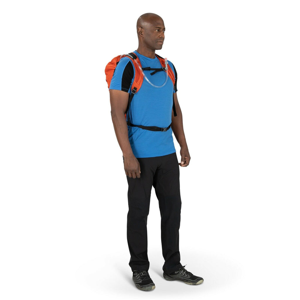 a person modeling the Skarab 18 in color firestarterorange