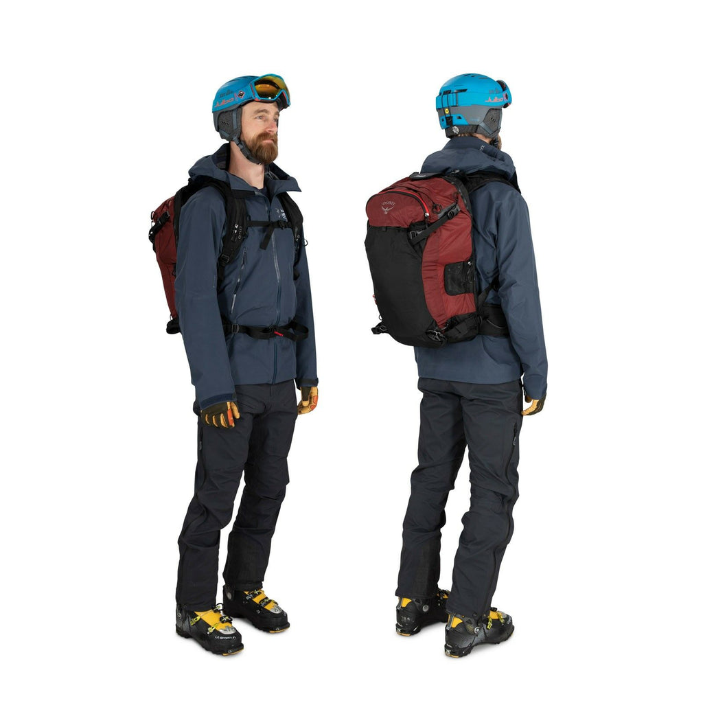 a person modeling the Soelden Pro 32 in color redmountain