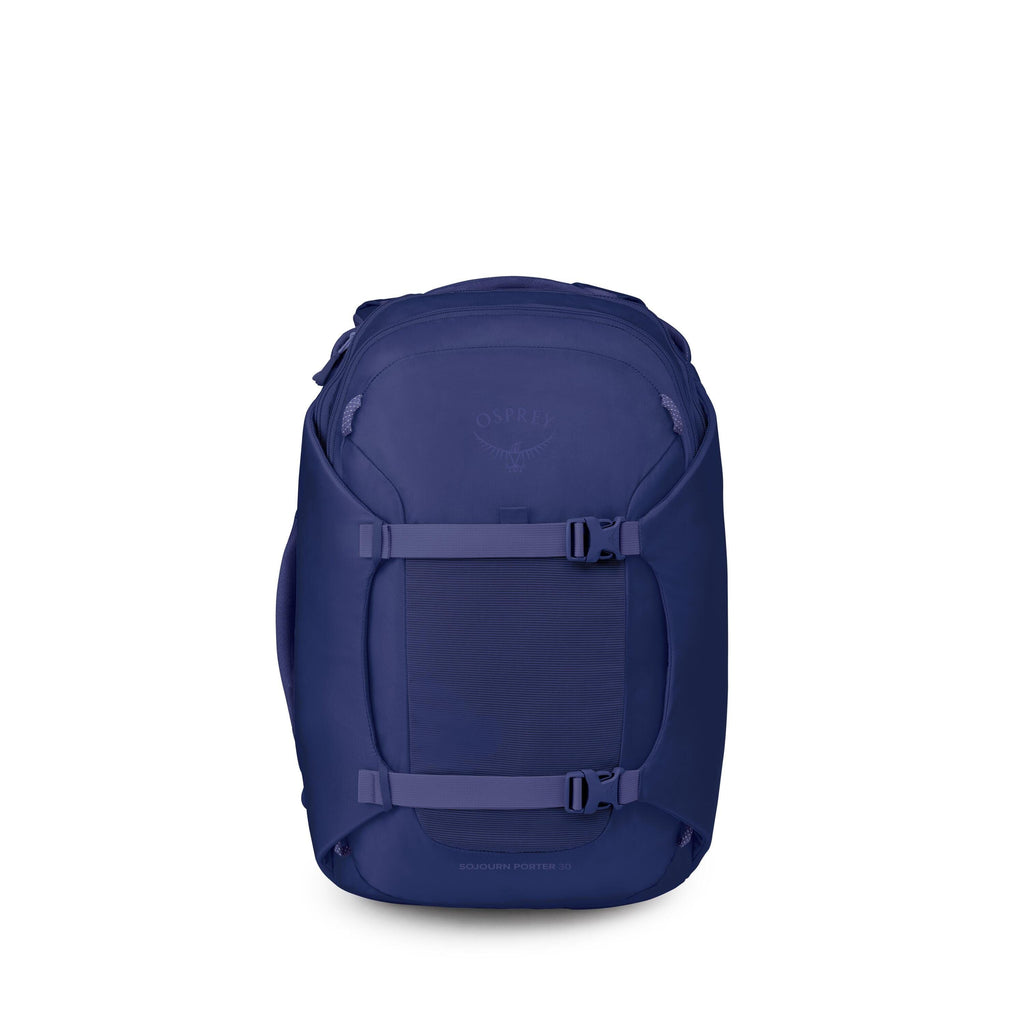 The image shows a dark blue Osprey backpack standing upright against a white background. It has a sleek, rounded shape with a large front panel and two horizontal compression straps with side-release buckles. Subtle Osprey branding is embossed near the to