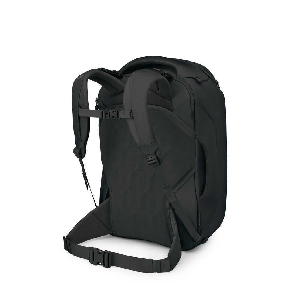The images show a sleek black backpack viewed from the back and slightly angled. It features thick, padded shoulder straps, a sternum strap, and a padded hip belt for support. The back panel has a textured, hexagonal pattern and there are side handles and