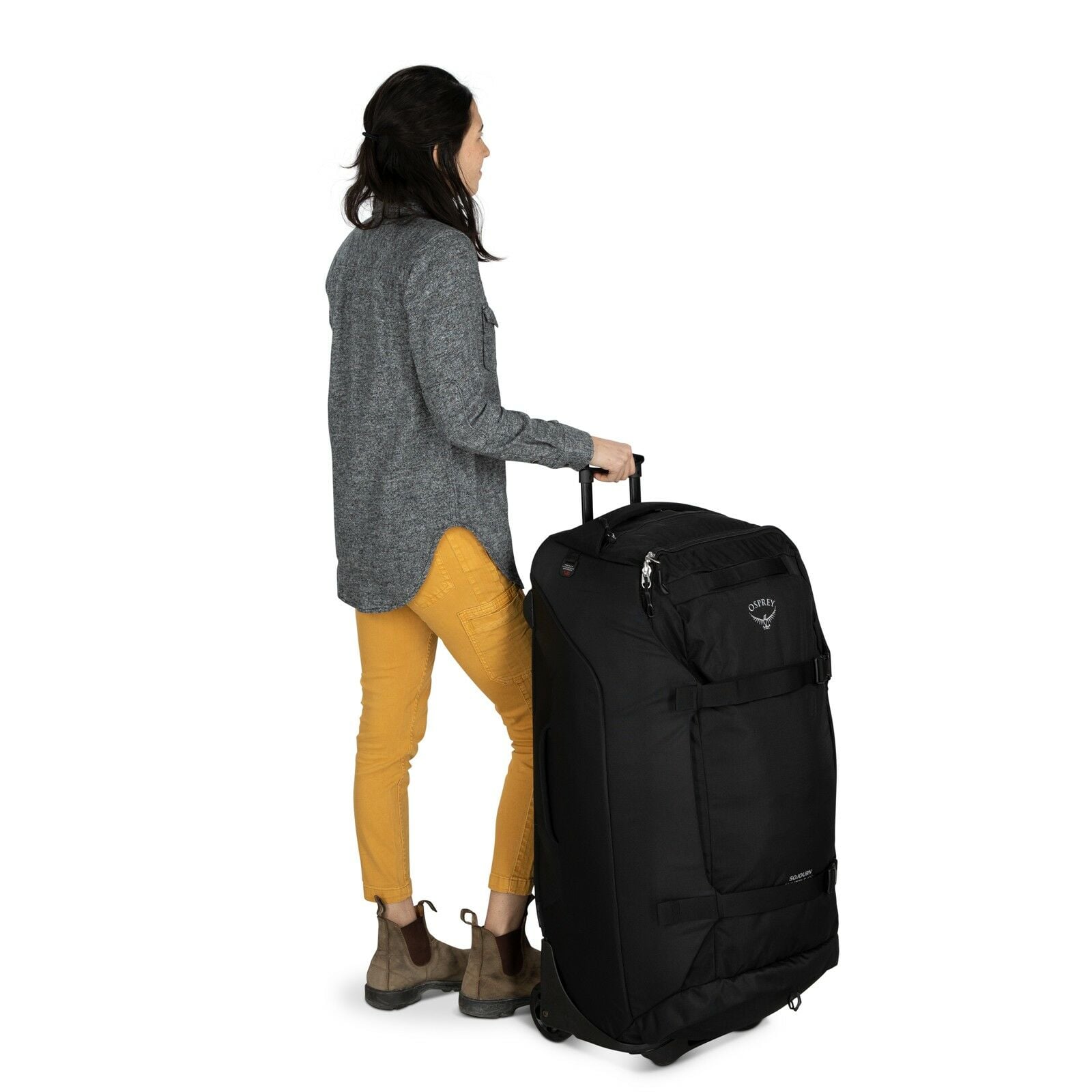 a person modeling the Sojourn™ Shuttle Wheeled Duffel 36"/130L in color Black