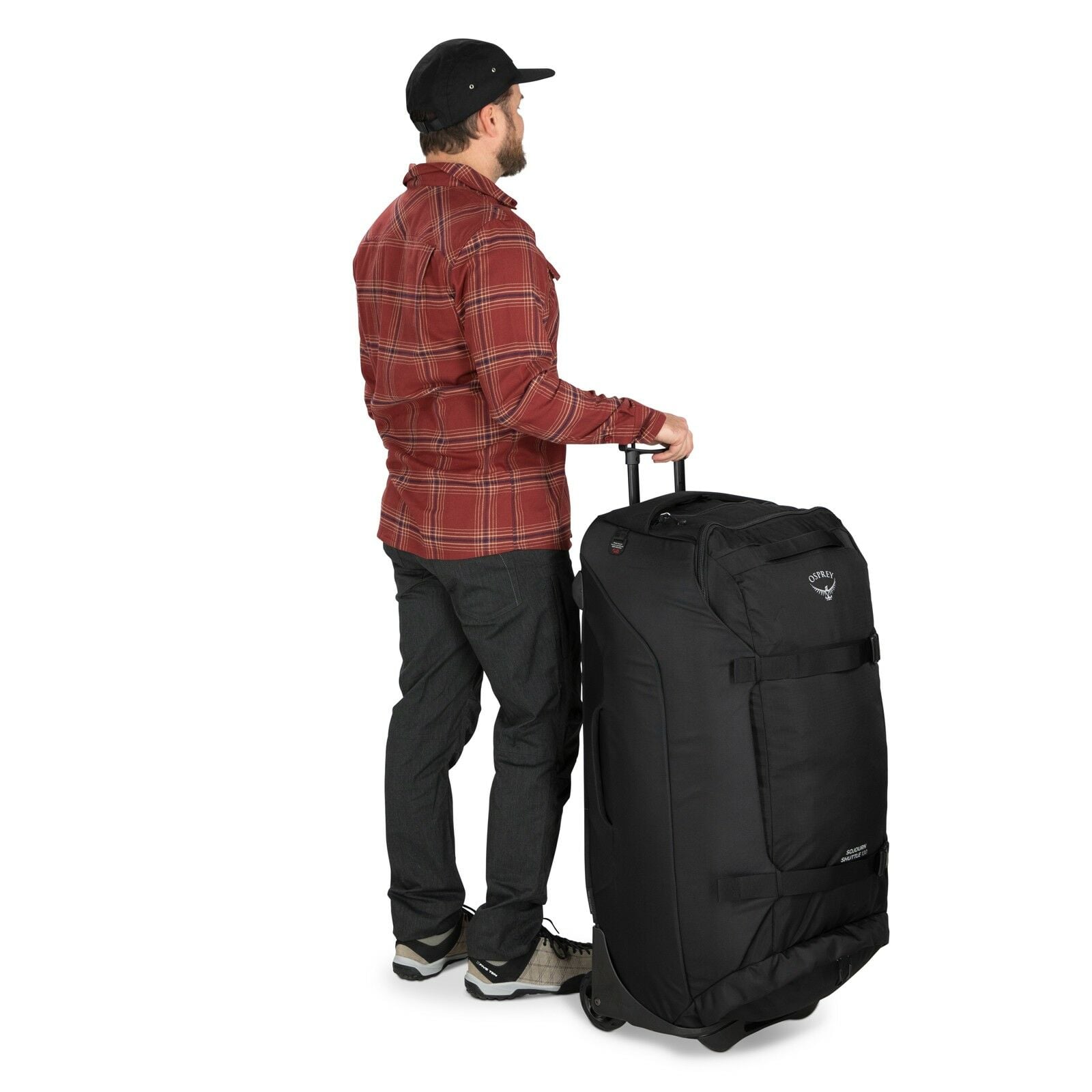 a person modeling the Sojourn™ Shuttle Wheeled Duffel 36"/130L in color Black
