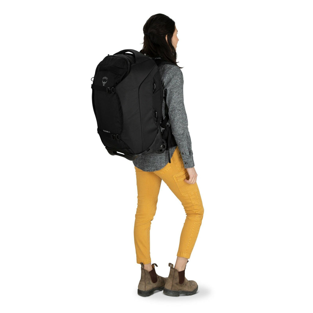 a person modeling the Sojourn™ Wheeled Travel Pack 22"/45L in color Black
