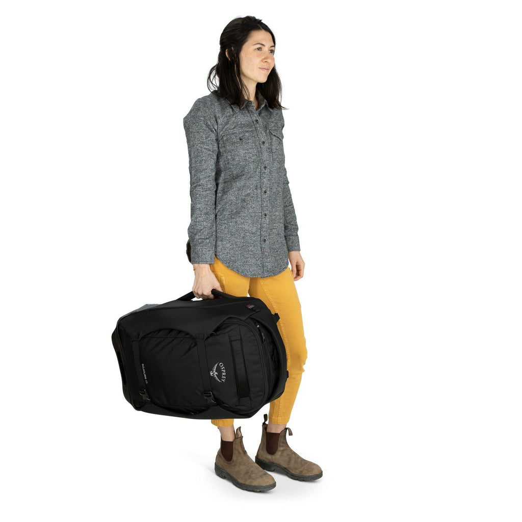 a person modeling the Sojourn™ Wheeled Travel Pack 22"/45L in color Black