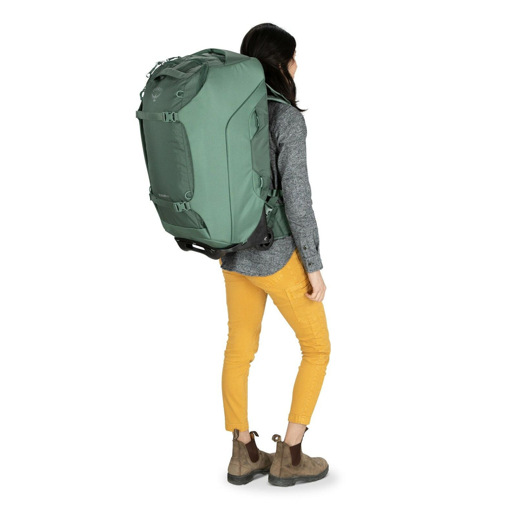 a person modeling the Sojourn™ Wheeled Travel Pack 25"/60L in color Black