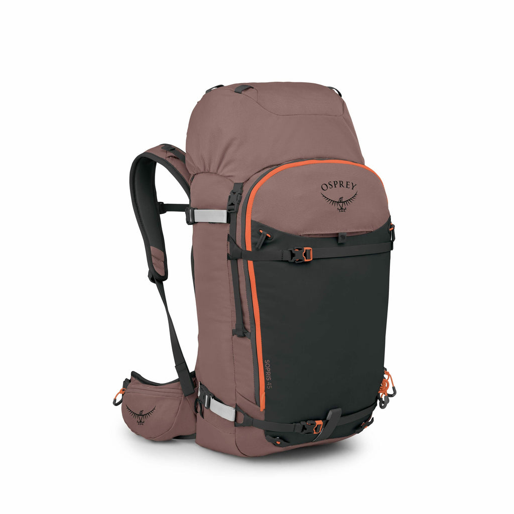 The image showcases a high-capacity Osprey backpack designed for outdoor activities such as hiking and camping. The backpack is primarily a warm brown color with a large black front pocket and vibrant orange accents, including buckles and straps, adding c