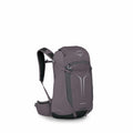 The image showcases a backpack designed by Osprey, called the Sportlite 22, featuring a sleek and functional design. The backpack is predominantly a dark gray color, with lighter gray accents and reflective elements on the front for visibility. It include