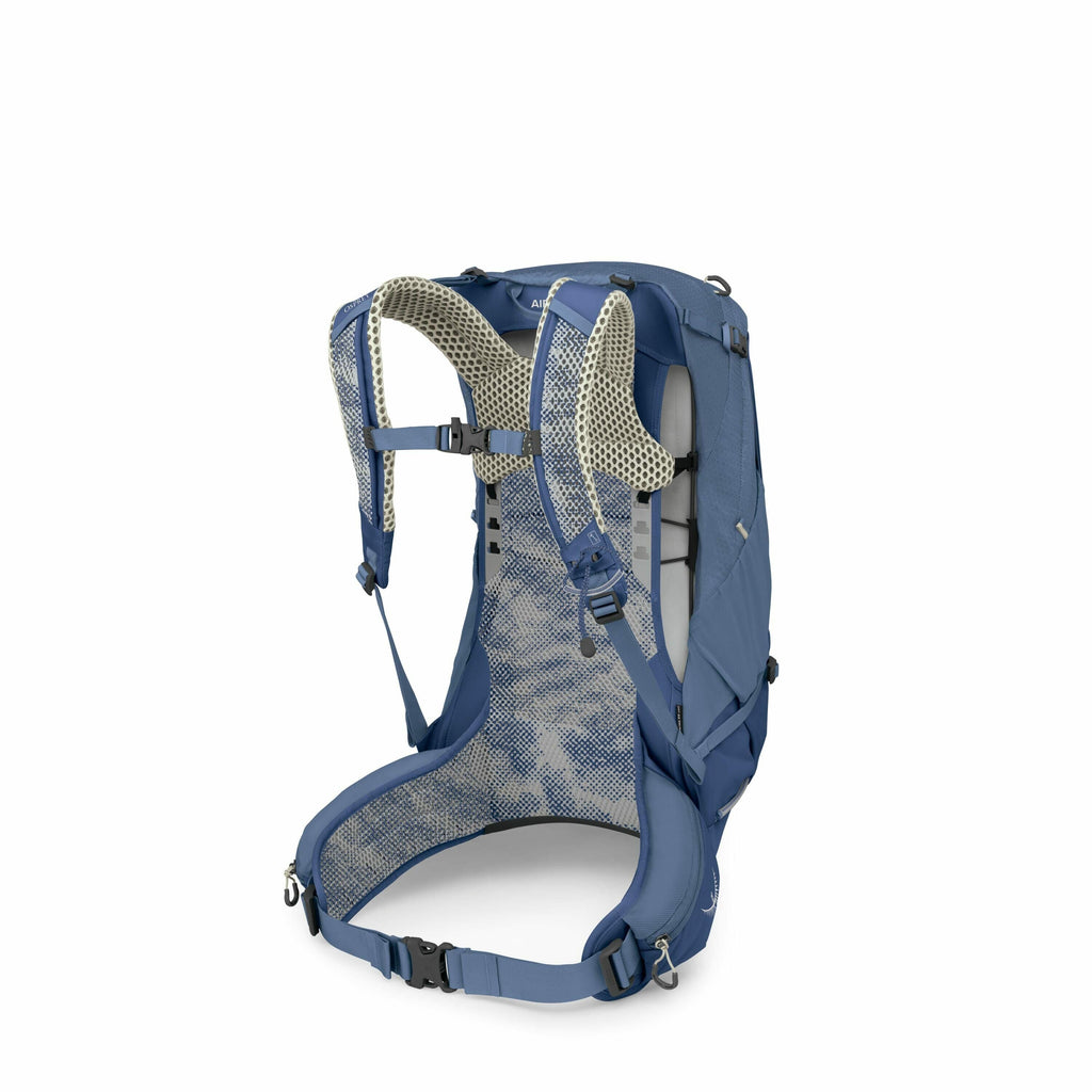 The image features a detailed view of a hiking backpack, showcasing the back and strap area. It is a deep blue color with lighter mesh material visible on the shoulder straps and back panel for comfort and breathability. The backpack has multiple adjustab