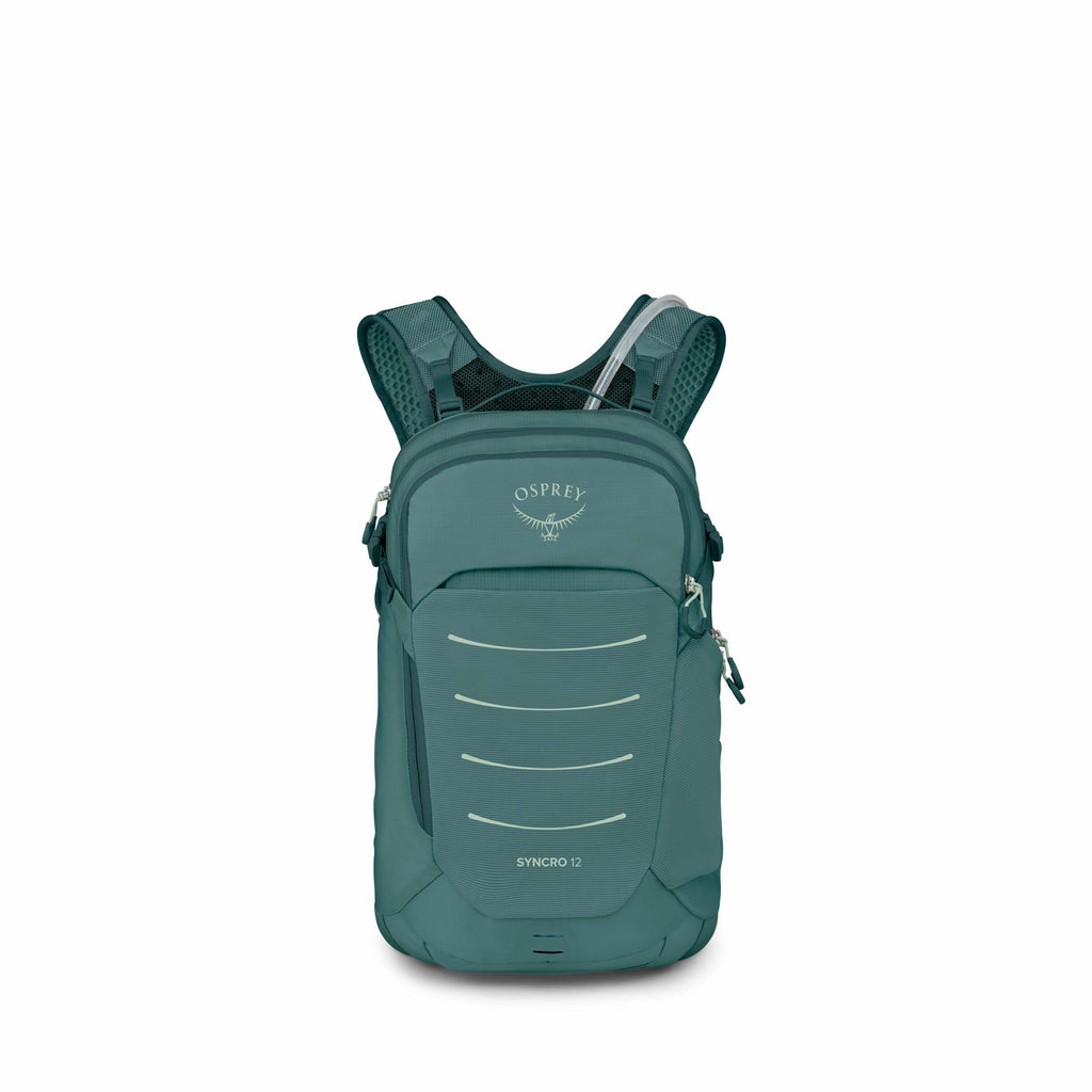 The image shows a teal-colored Osprey Syncro 12 backpack. It is designed with several horizontal reflective lines on the front for visibility and has the Osprey logo, featuring a stylized bird, prominently displayed above these lines. The backpack has adj