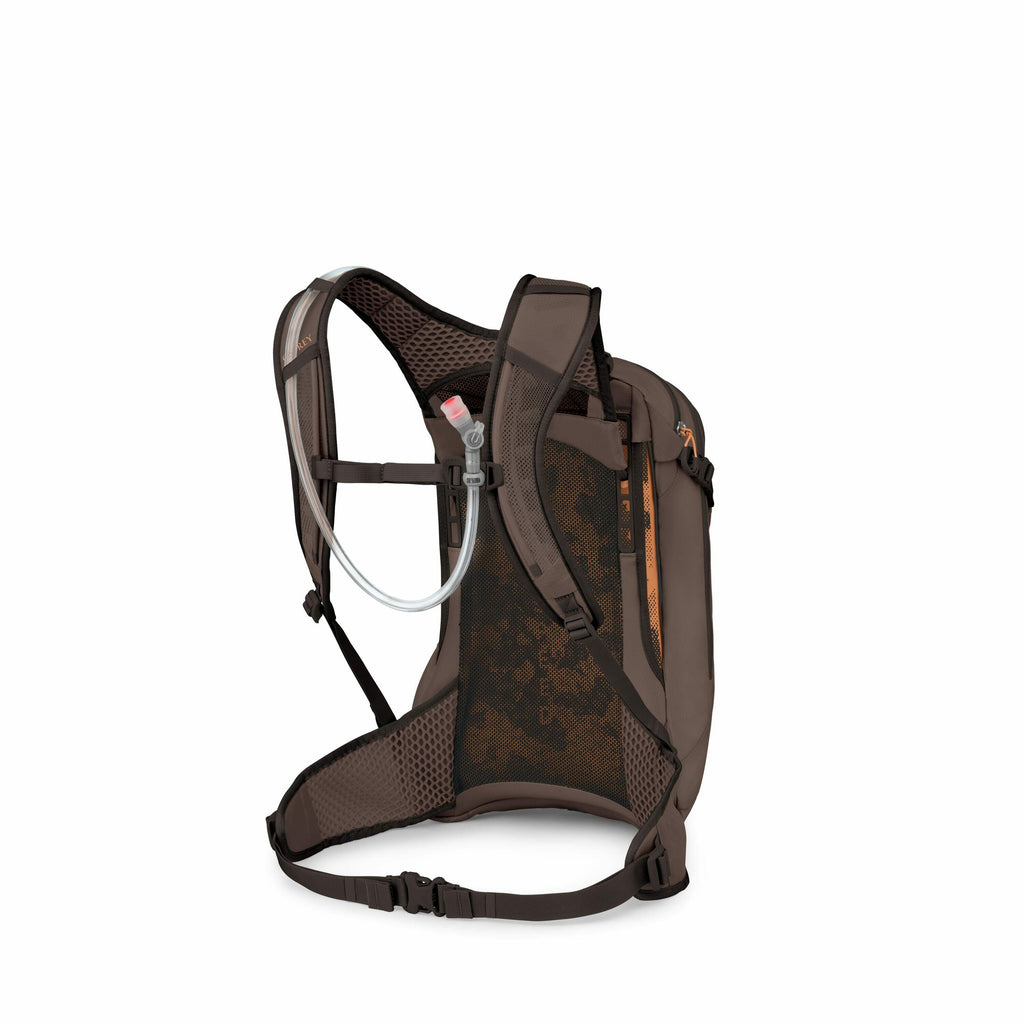 The image shows a brown backpack designed for outdoor activities, specifically for hydration. It features a hydration system with a clear hose and a pink bite valve, allowing easy access to water while on the go. The backpack has ergonomic, padded shoulde