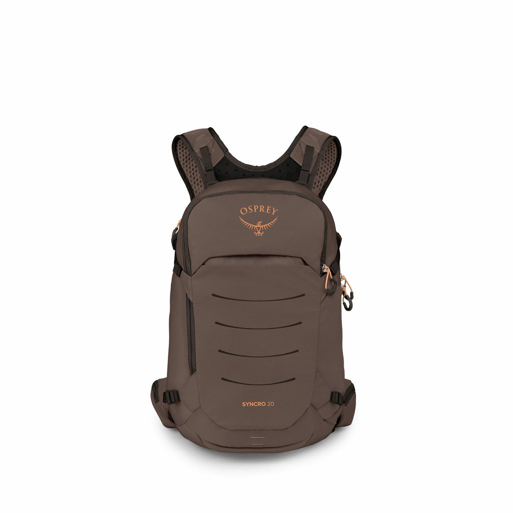 The image showcases a backpack designed by Osprey, known as the Syncro 20 model. The backpack has a sleek design in a dark taupe color, featuring the Osprey logo prominently displayed on the upper front section in orange. It includes multiple compartments