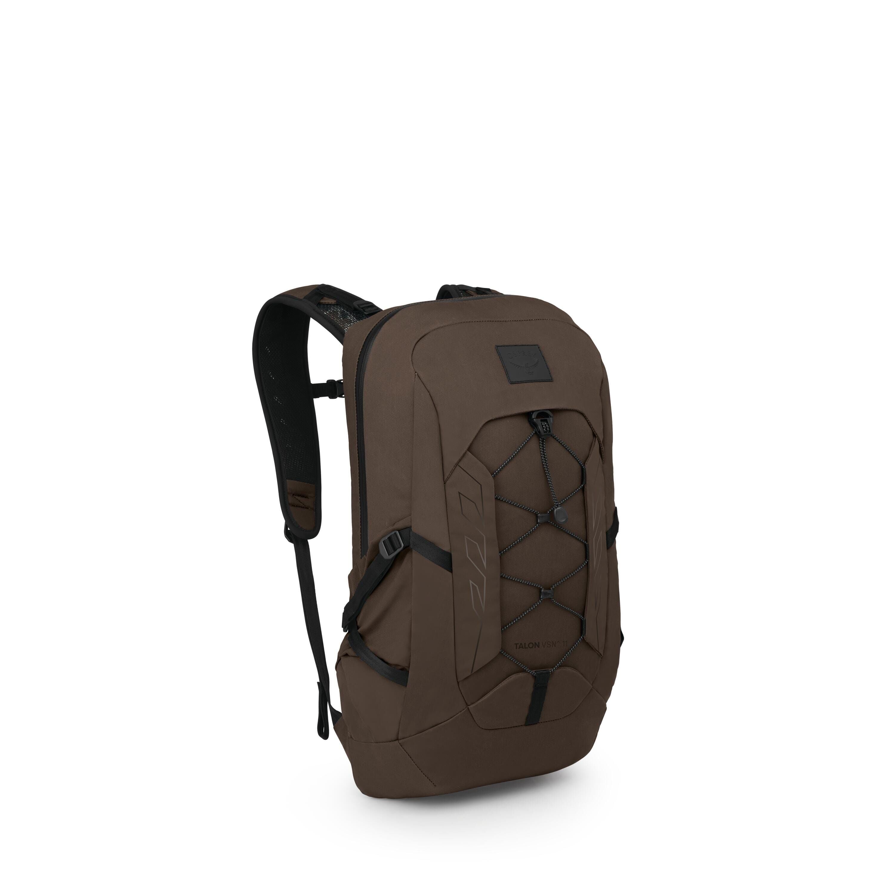 A sleek brown backpack is shown from a three-quarter front angle on a white background. It features a streamlined, rectangular shape with a front bungee cord system and compression straps on the sides. The shoulder straps are padded and contoured, and the