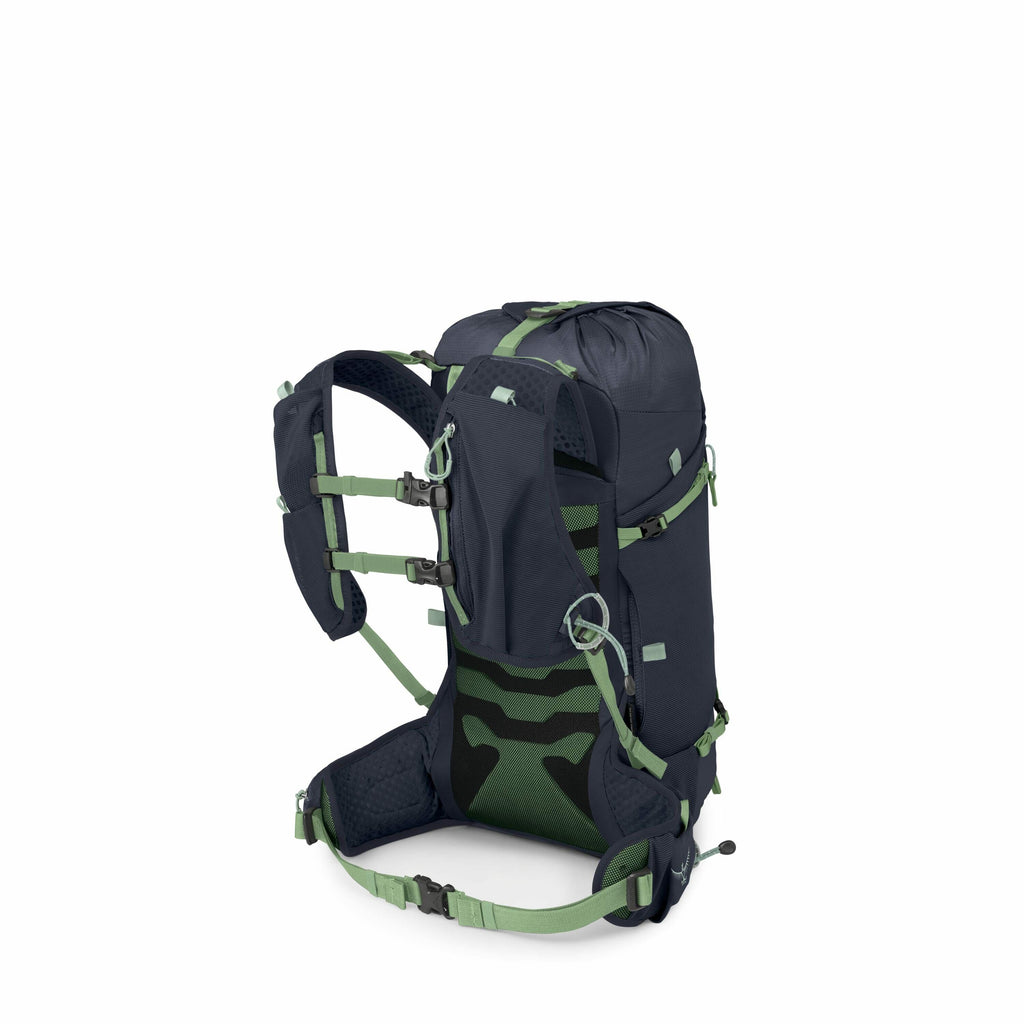 The image displays a dark blue hiking backpack with green accents. It features adjustable padded shoulder straps, a supportive back panel with green mesh, and a padded hip belt for comfort. The backpack has multiple attachment points, buckles, and compres