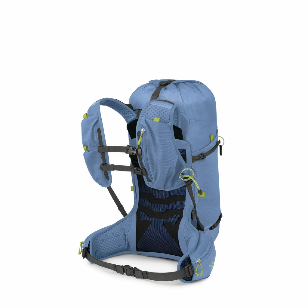The image showcases a high-quality, outdoor backpack designed for hiking or trekking. It is primarily light blue with small lime green accents on the zippers and loops, providing a contrast that adds visibility and style. The backpack features a well-padd