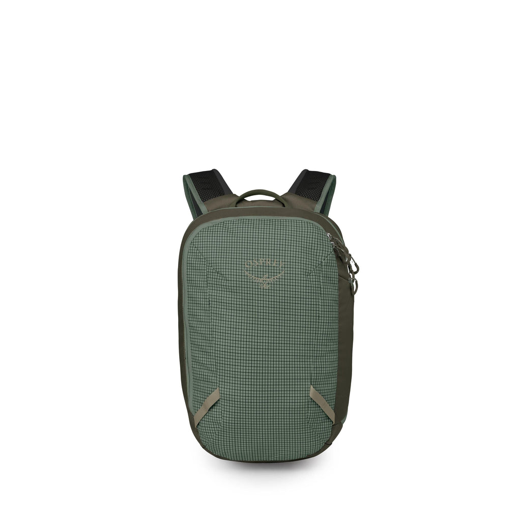 A compact green backpack is shown from the front, featuring a subtle grid-patterned fabric panel and darker olive sides. It has a rounded rectangular shape with a top haul handle and two padded shoulder straps. A large zippered main compartment runs along