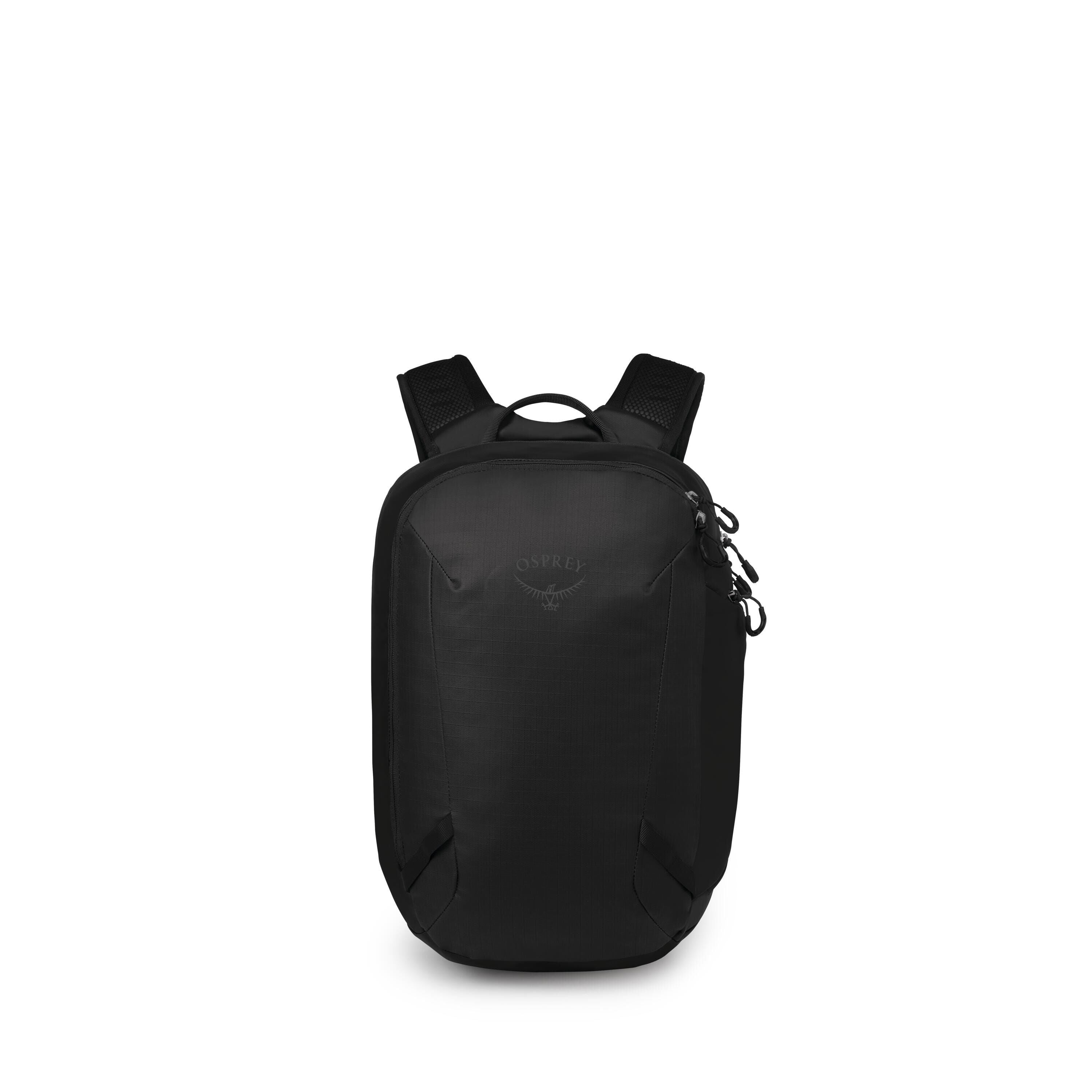 A sleek black Osprey backpack is centered against a white background. It has a compact, rounded rectangular shape with minimal seams and a subtle Osprey bird logo on the front panel. The bag features padded shoulder straps, a top grab handle, and side zip