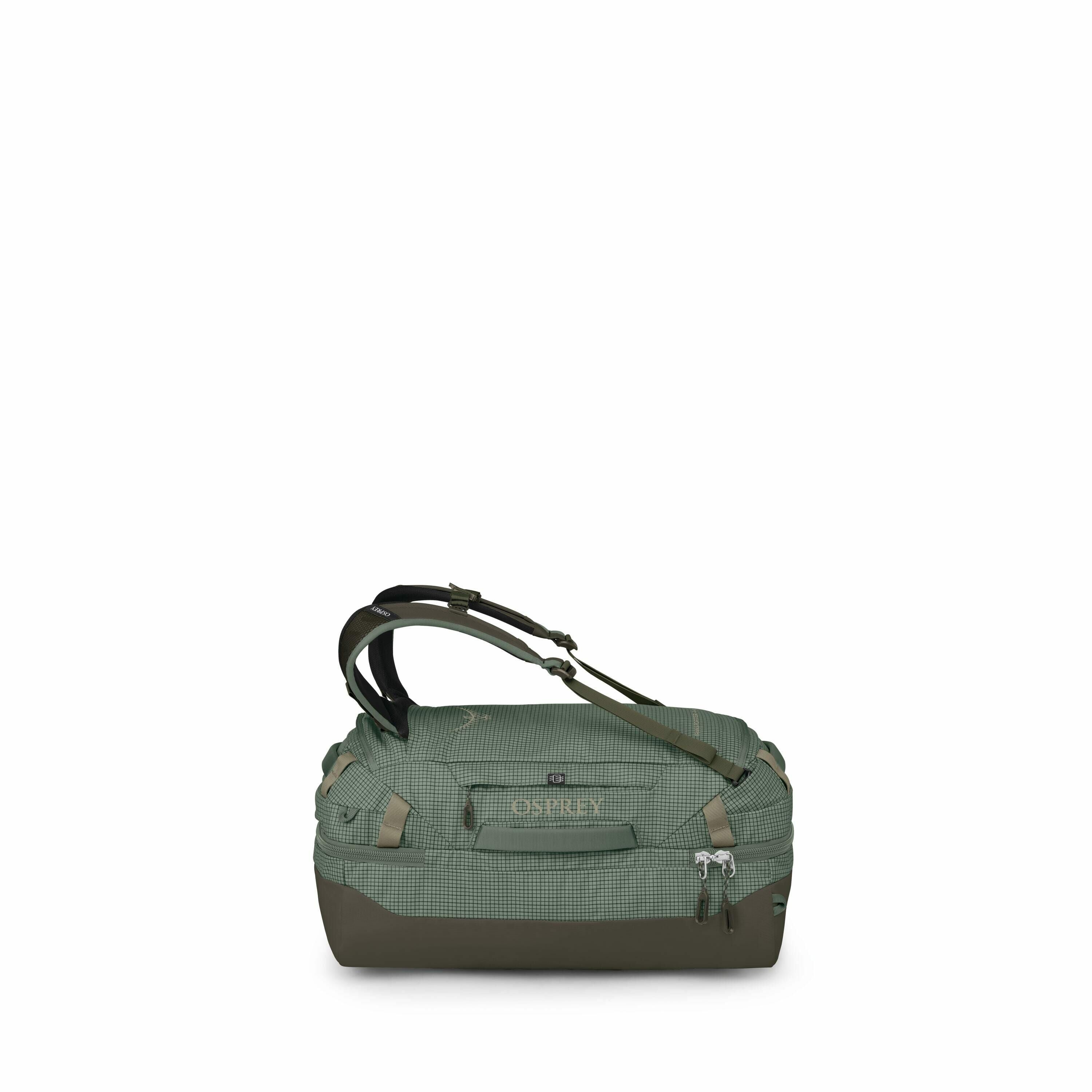 The image series shows a green Osprey duffel bag from multiple angles and in various stages of collapse or compression, likely demonstrating its collapsible or compressible nature for compact storage. The bag features a checkered design with durable mater