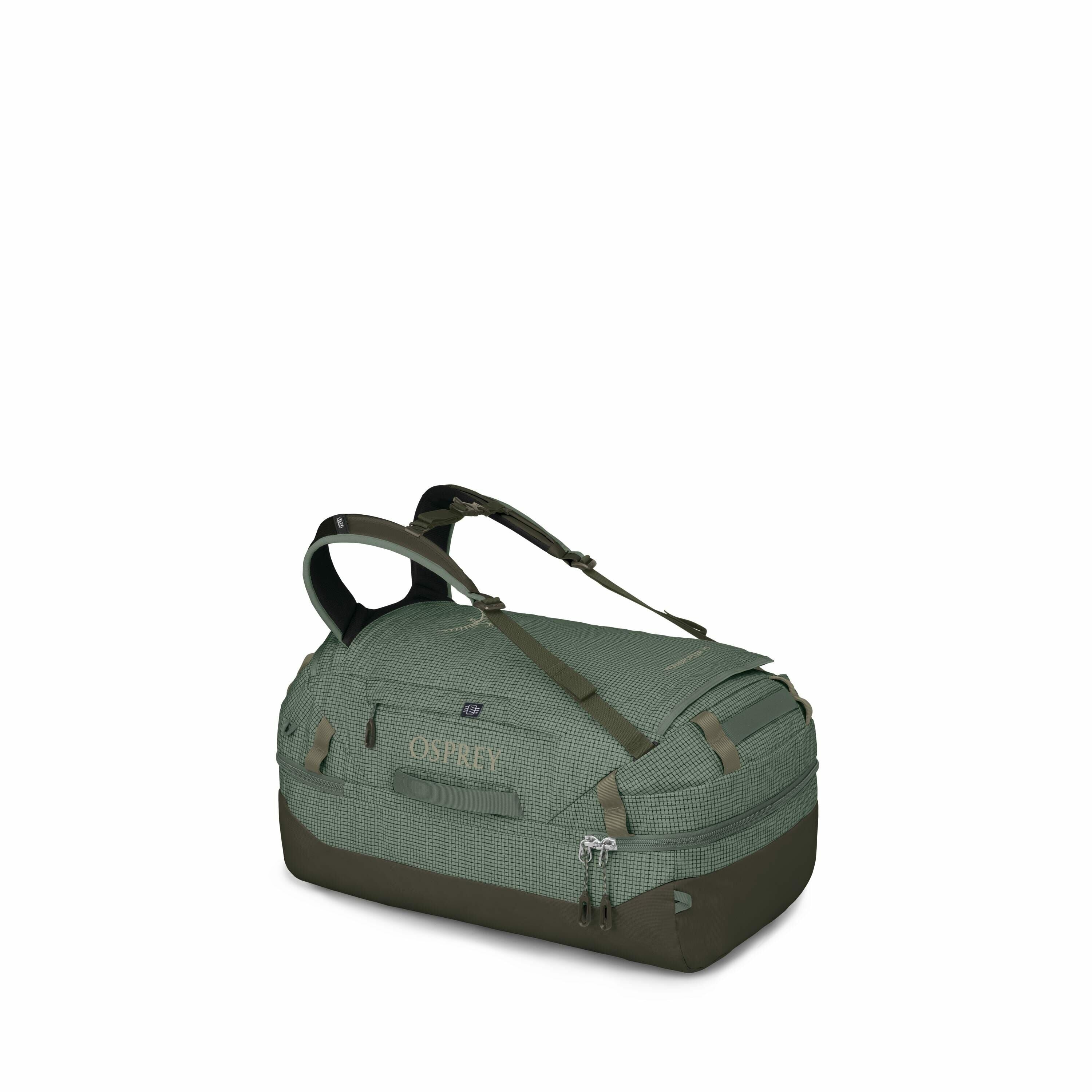 The image shows an Osprey travel bag in a subdued green color with darker green accents. It appears to be a medium-sized duffel-style bag, designed for functionality and ease of carrying, featuring multiple handles and straps. The bag has a textured patte