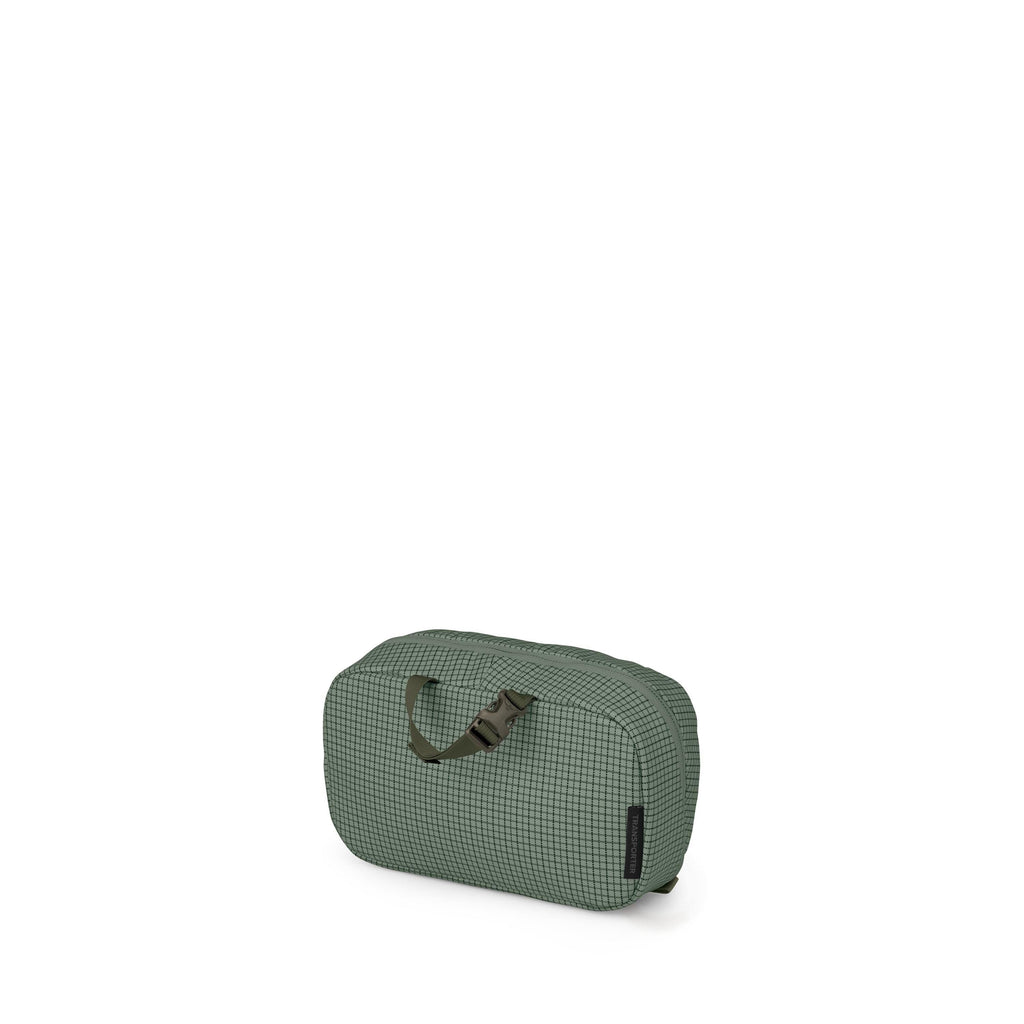 A small, rectangular travel pouch in green with a subtle grid pattern is shown against a white background. It has rounded corners, a zipper closure along the top, and a short webbing handle with a plastic buckle on the front. One variant shows the handle