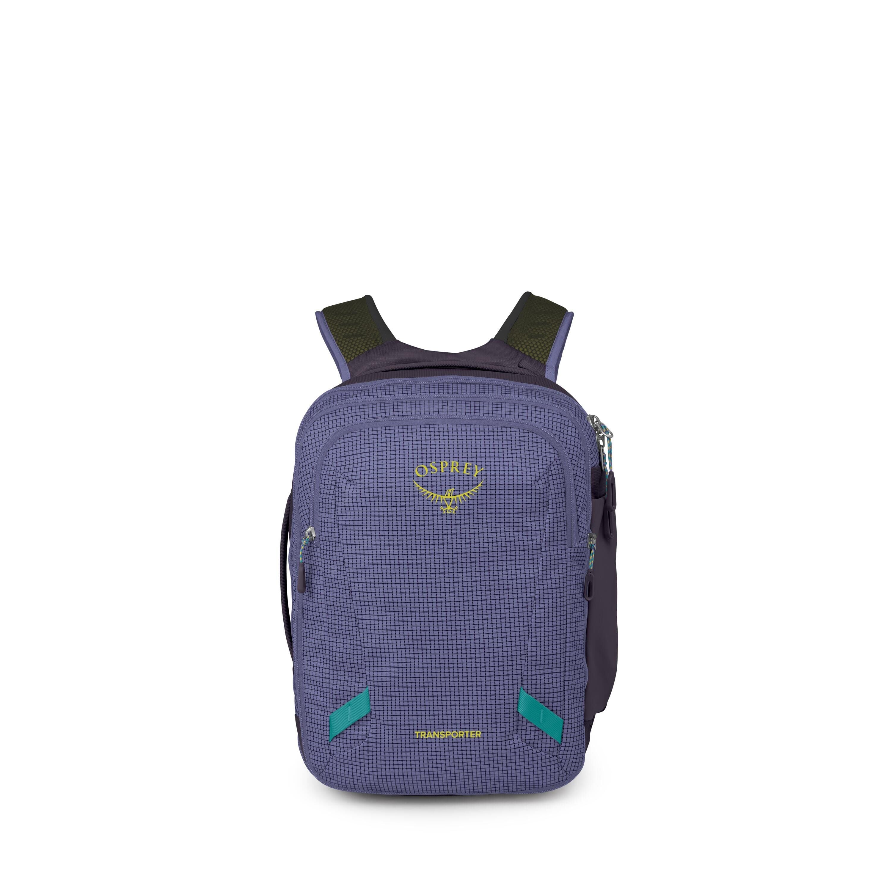 A compact Osprey backpack is shown standing upright against a white background. It has a blue grid-patterned front panel with the yellow Osprey logo and the word "Transporter" near the bottom. The pack features two front zip compartments, side zips, and p