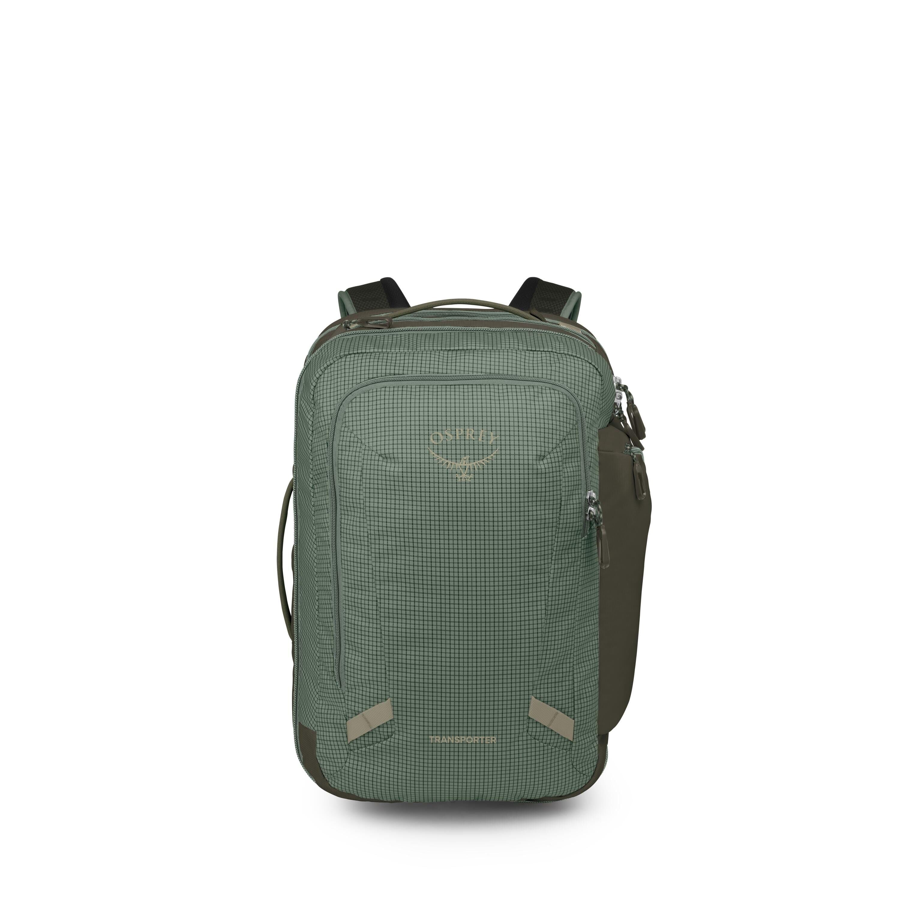The images show a green Osprey backpack photographed from the front. It has a grid-patterned fabric, two front zip compartments, and small reflective tabs near the bottom corners. Side pockets and padded shoulder straps are visible, along with a top carry