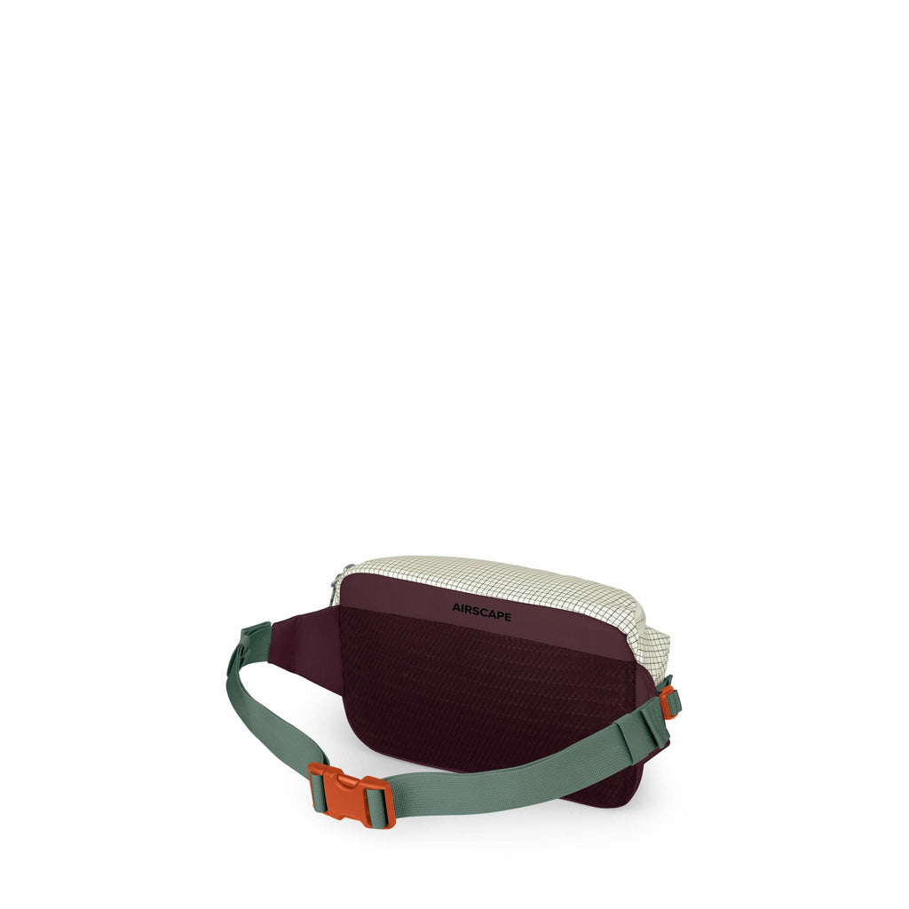 The image shows a small, compact waist pack designed for outdoor or casual use. The bag is primarily a dark maroon color with a light grid pattern on the top, and it features the word "AIRSCAPE" on its front. It has an adjustable green strap with an orang