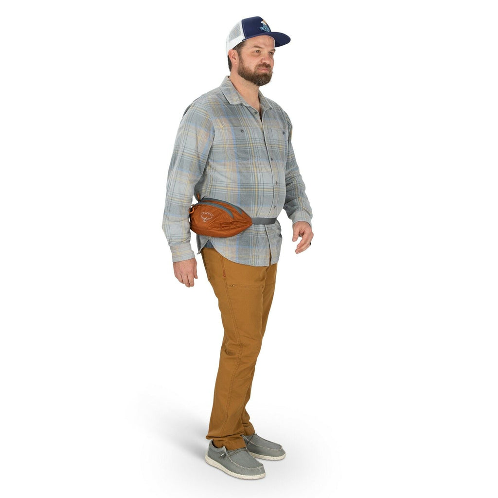 a person modeling the Ultralight Stuff Waist Pack in color toffeeorange