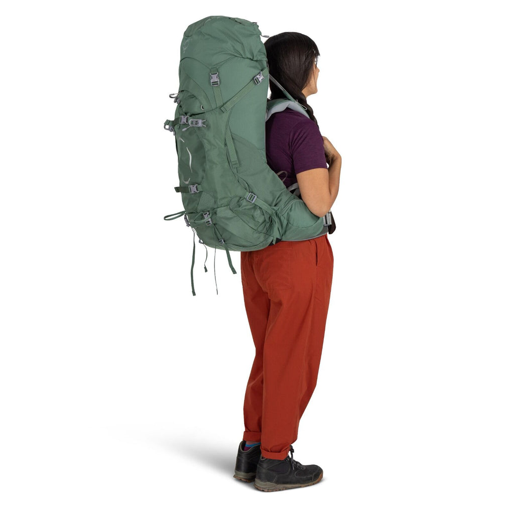 a person modeling the ARIEL 55 in color Koseret Green