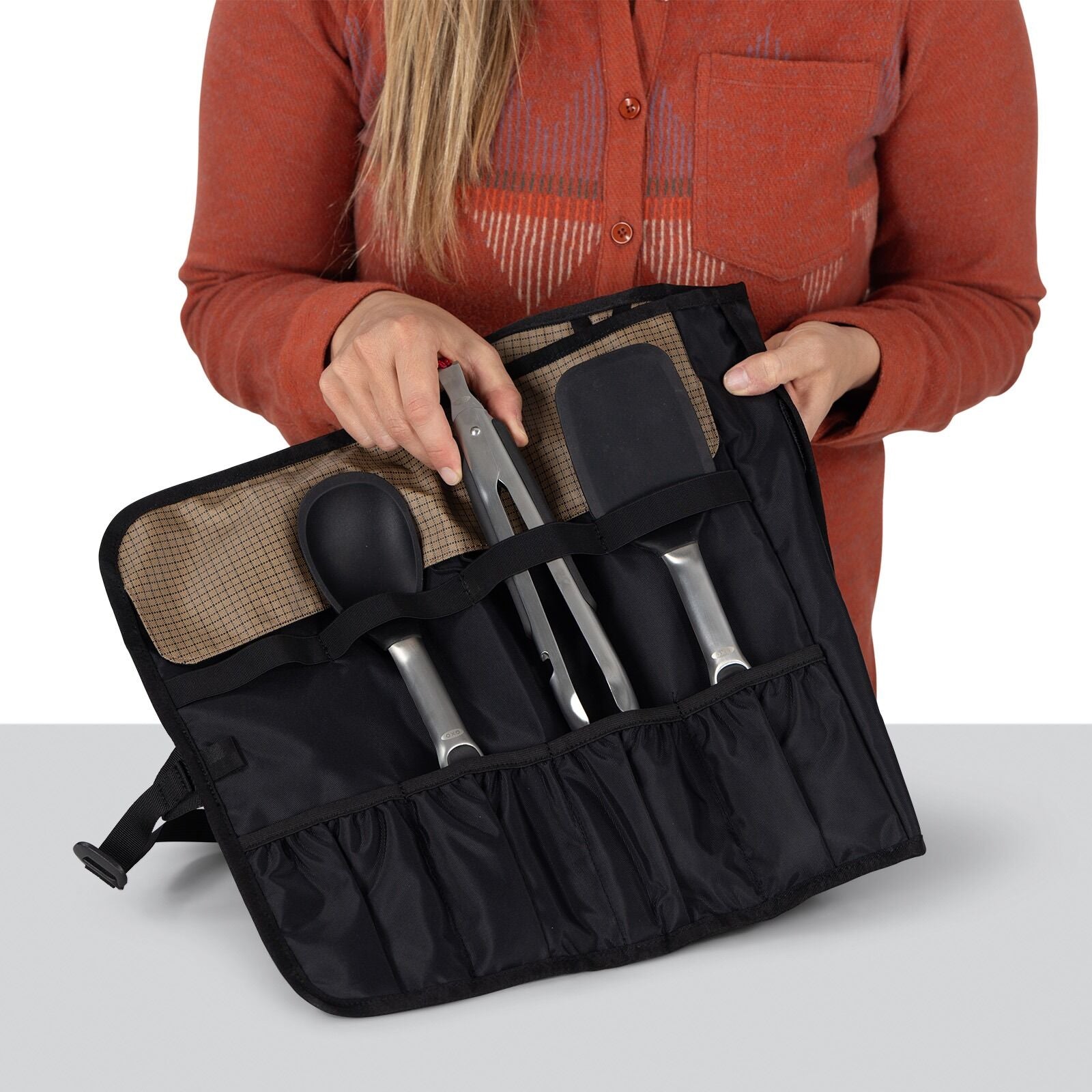 detailed image of the Oxo Campcore cooking tool roll and utensil set