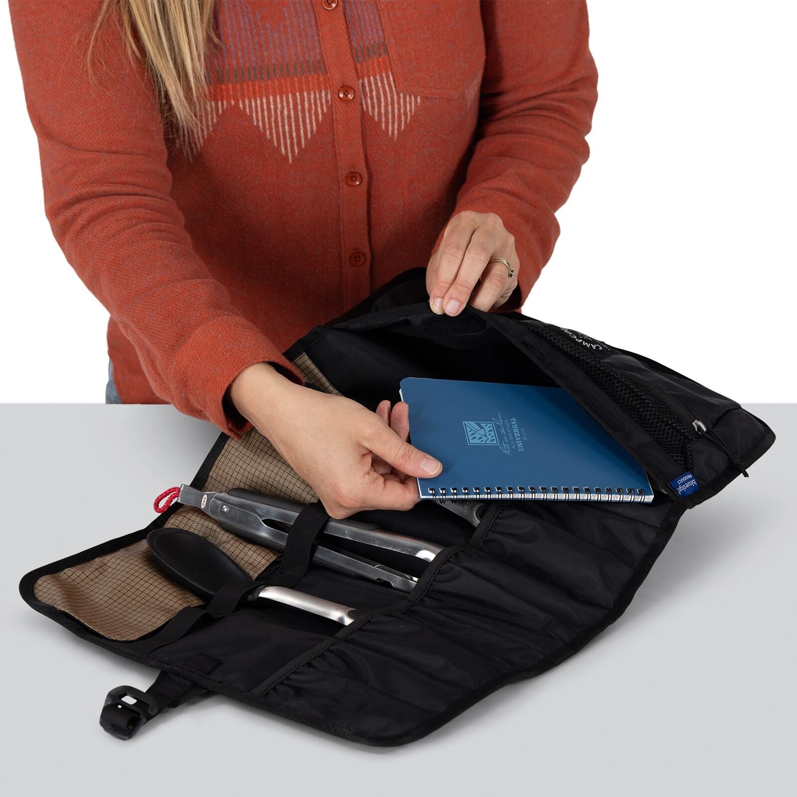 detailed image of the Oxo Campcore cooking tool roll and utensil set with utensils