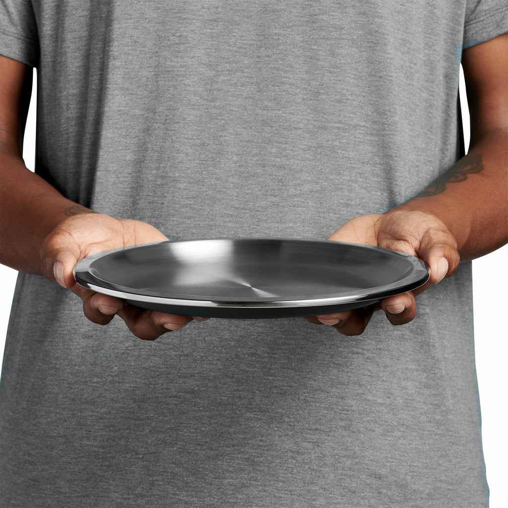 Image of someone holding the Hydro Flask Campcore Camp Plate
