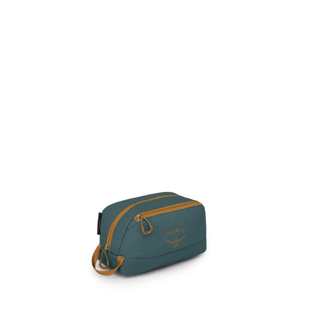 The image shows a small toiletry or accessory bag in teal with mustard-yellow zippers and accents. It has a compact, rectangular shape with rounded edges, a top carry loop, and two zipper pulls. The front features the Osprey logo in matching mustard color