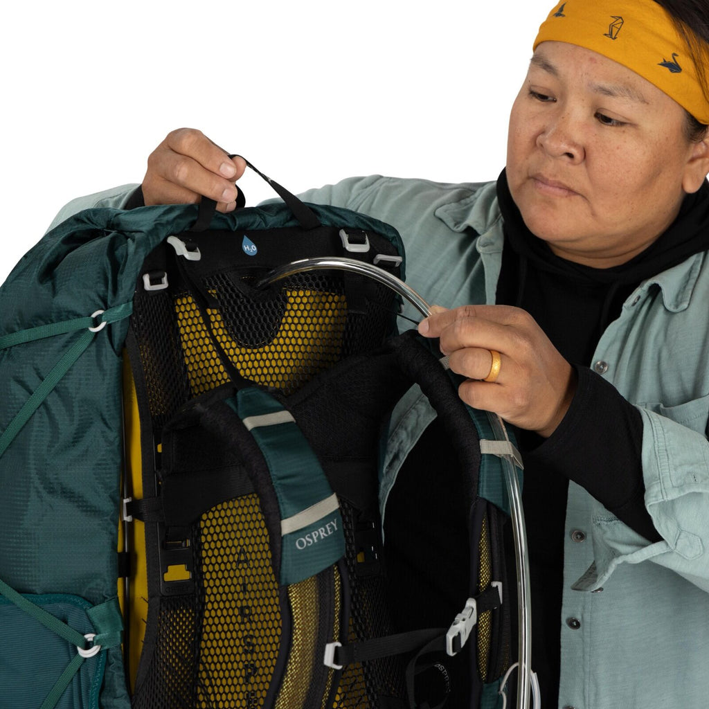 model wearing the Eja 58 Extended Fit in color Deep Teal