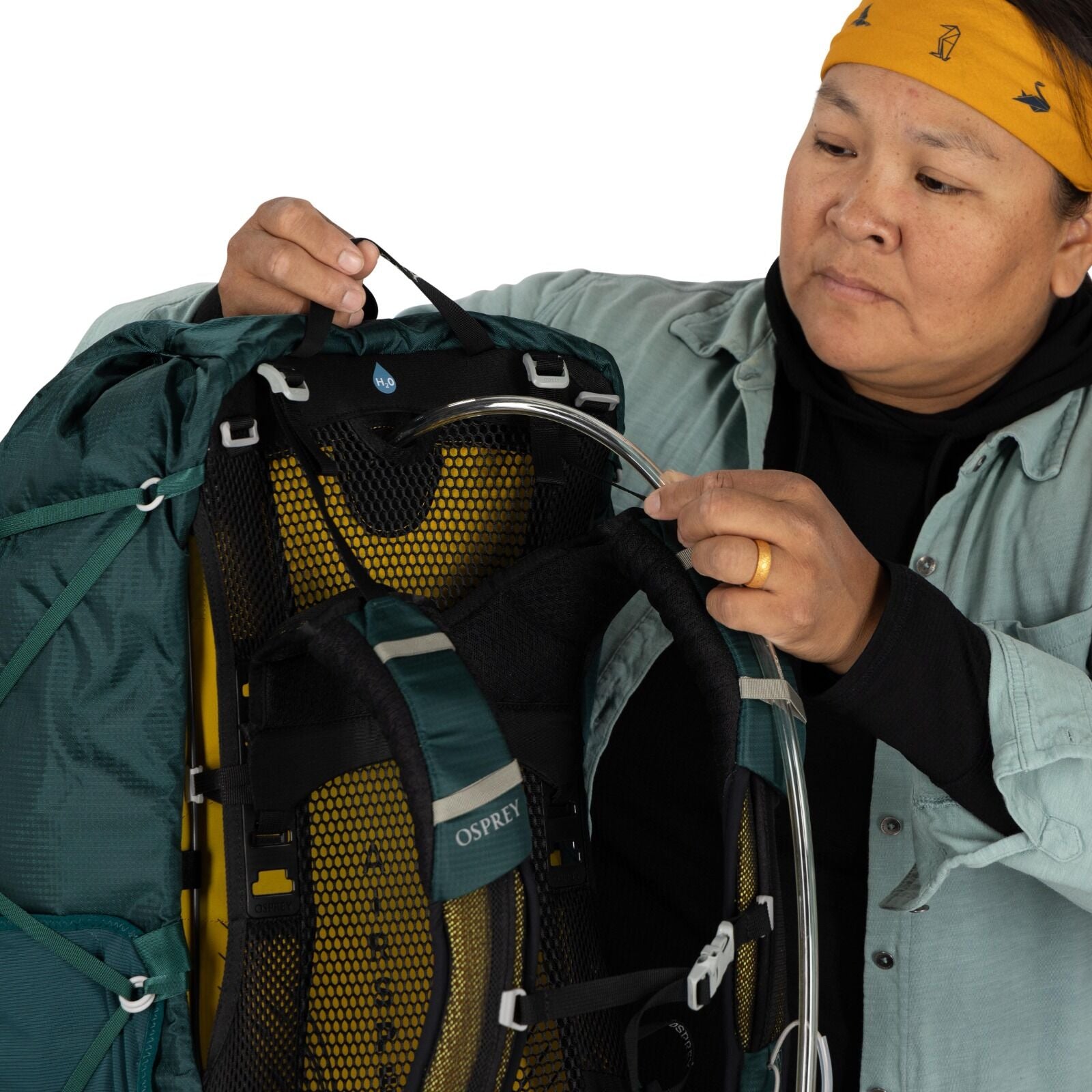 model wearing the Eja 58 Extended Fit in color Deep Teal