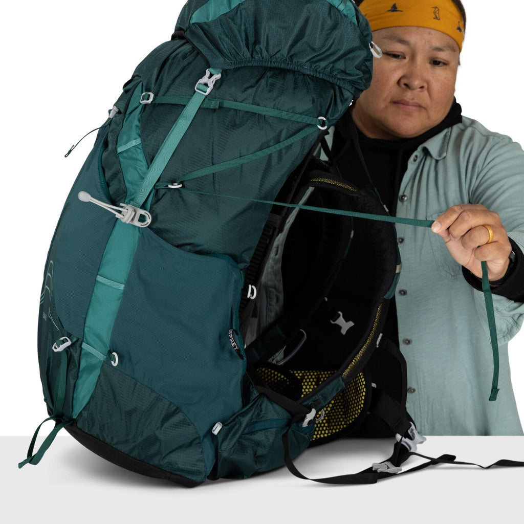 model wearing the Eja 58 Extended Fit in color Deep Teal