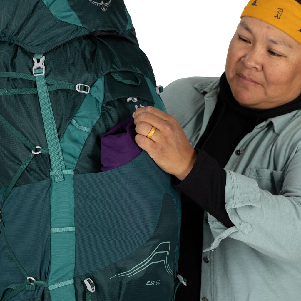 model wearing the Eja 58 Extended Fit in color Deep Teal