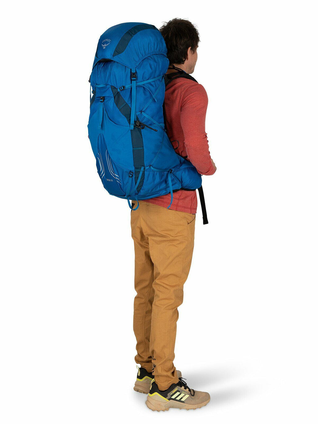 a person modeling the EXOS 58 in color Blue Ribbon