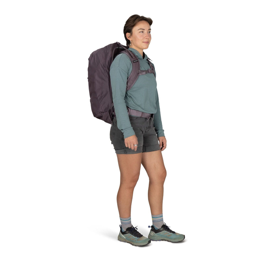 Image of a person modeling the Fairview 40 Travel pack in the color Graphite Purple.