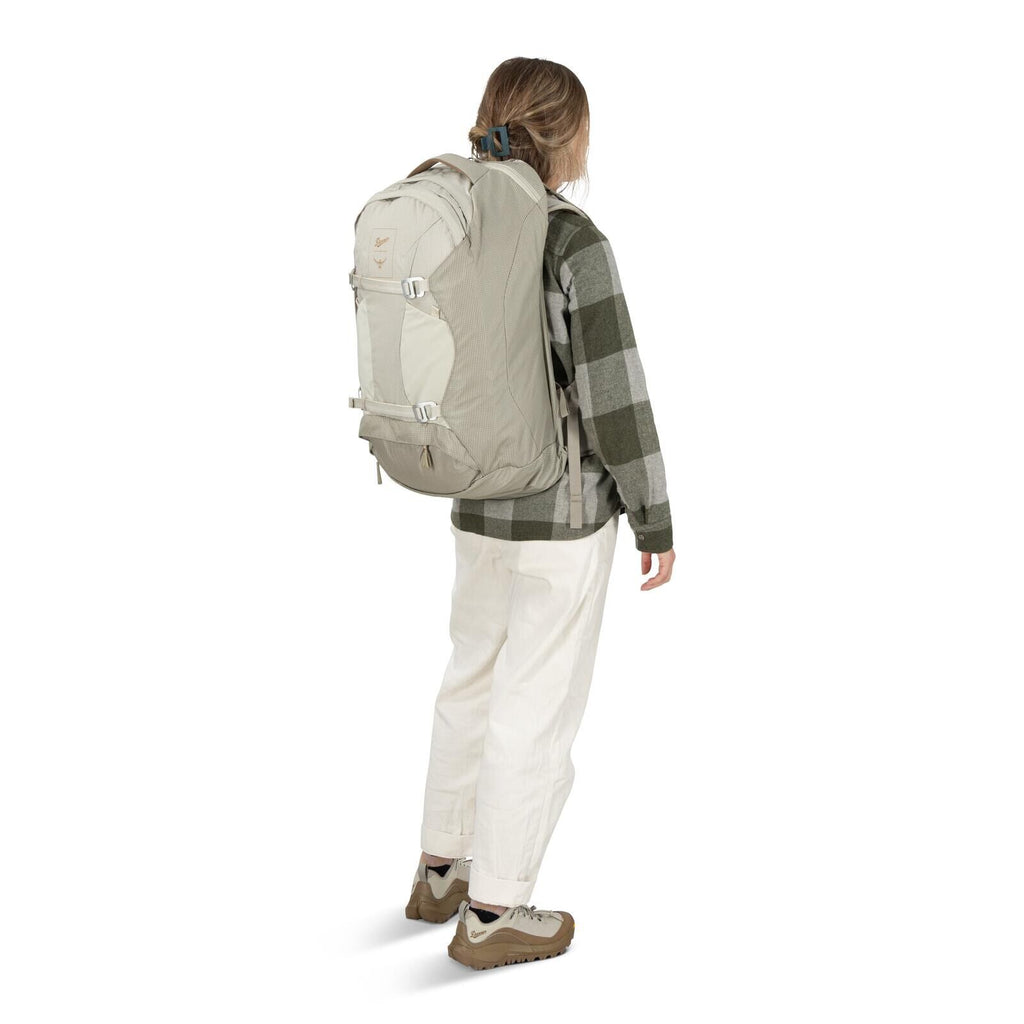 Model on-body image of Osprey Fairview 40 and Danner collaboration in the color Sandy Grey-Sawdust